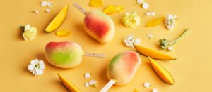 Snowflake Gelato's premium Snow Mango stick with crackable shell, hand-dipped in golden coating.